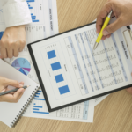 2 People working with paper work